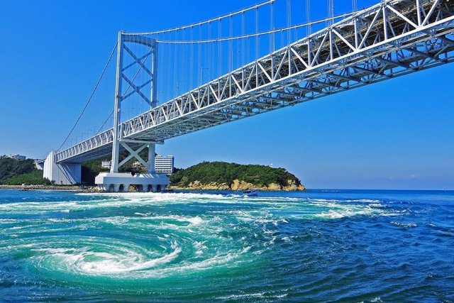 Pleasure boat to view Naruto Whirlpools, Onaruto Bridge of Tokushima.